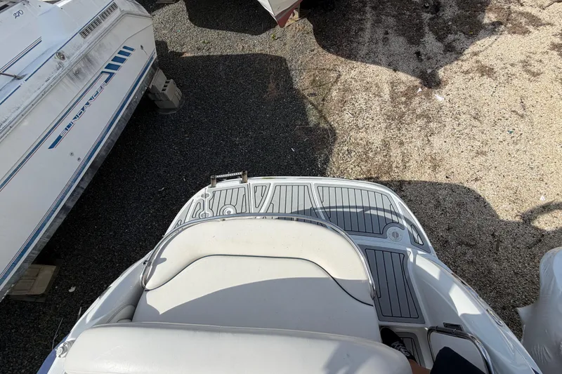 Slide: The Image of 2006 Crownline 270 CR boat stern view with seating and deck details. - 7