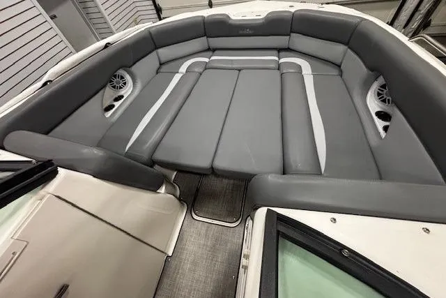 Slide: The Image of 2023 NauticStar 243DC Sport Deck boat interior with gray seating and modern design. - 10