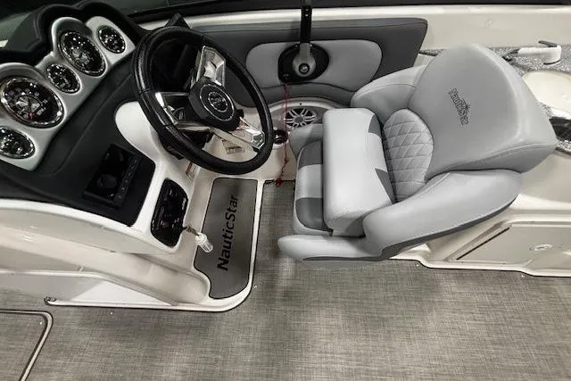 Slide: The Image of Garmin display on 2023 NauticStar 243DC Sport Deck dashboard with control panel. - 13