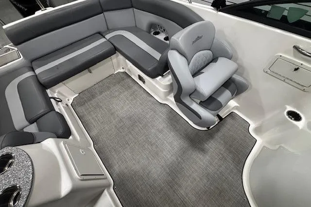 Slide: The Image of 2023 NauticStar 243DC Sport Deck boat interior with gray seating and speaker. - 15