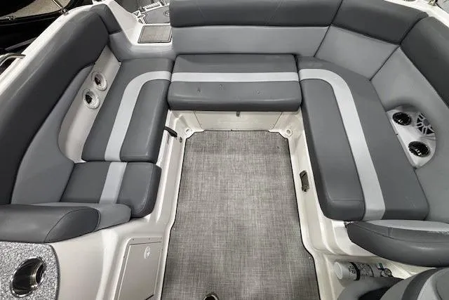 Slide: The Image of 2023 NauticStar 243DC Sport Deck boat interior with gray seating and modern design. - 20
