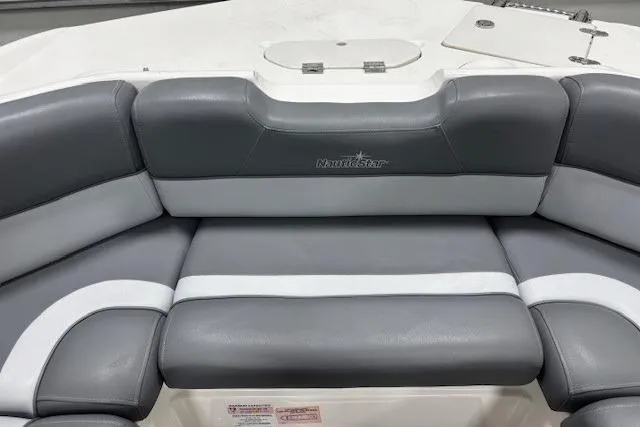 Slide: The Image of 2023 NauticStar 243DC Sport Deck boat with Mercury outboard engine in showroom. - 21