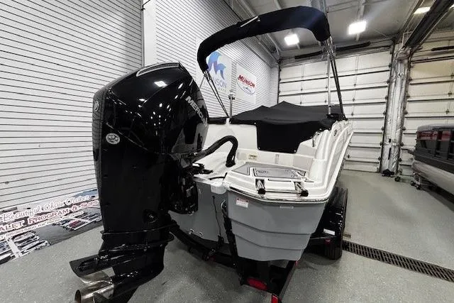 Slide: The Image of 2023 NauticStar 243DC Sport Deck interior with modern seating and sleek dashboard design. - 25