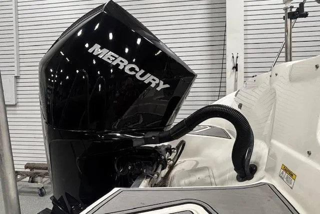 Slide: The Image of 2023 NauticStar 243DC Sport Deck interior with gray seating and textured flooring. - 35