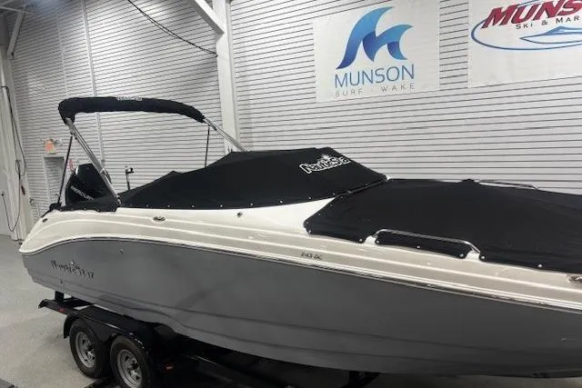 Slide: The Image of 2023 NauticStar 243DC Sport Deck boat, rear view with sleek design and modern features. - 39