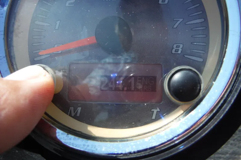 Slide: The Image of Close-up of a 2011 Yamaha Boats 242 Limited speedometer displaying engine hours. - 14