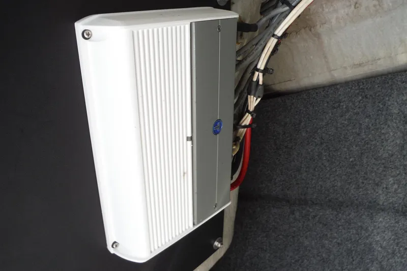 Slide: The Image of Amplifier installation in 2011 Yamaha Boats 242 Limited, featuring wiring and secure mounting. - 18