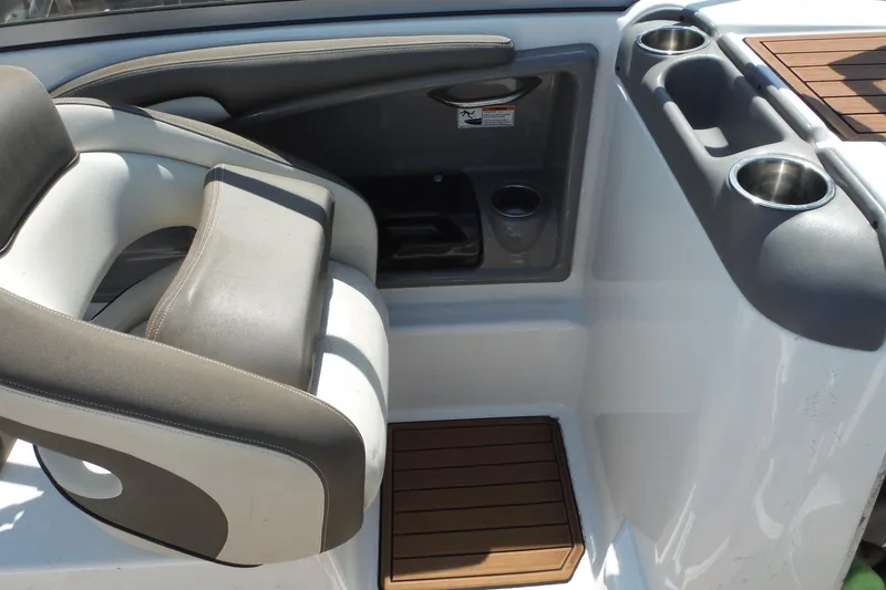 Slide: The Image of Interior seating and cup holders of a 2011 Yamaha Boats 242 Limited. - 21