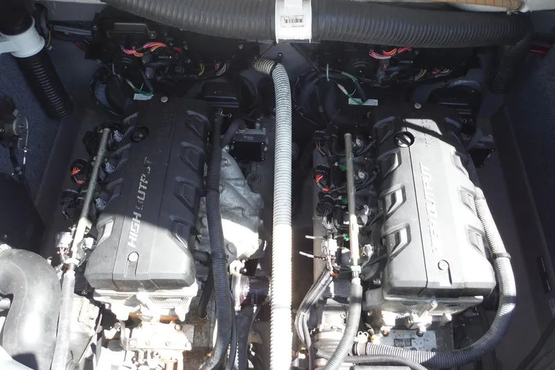 Slide: The Image of 2011 Yamaha Boats 242 Limited engine compartment with dual high-output engines. - 22