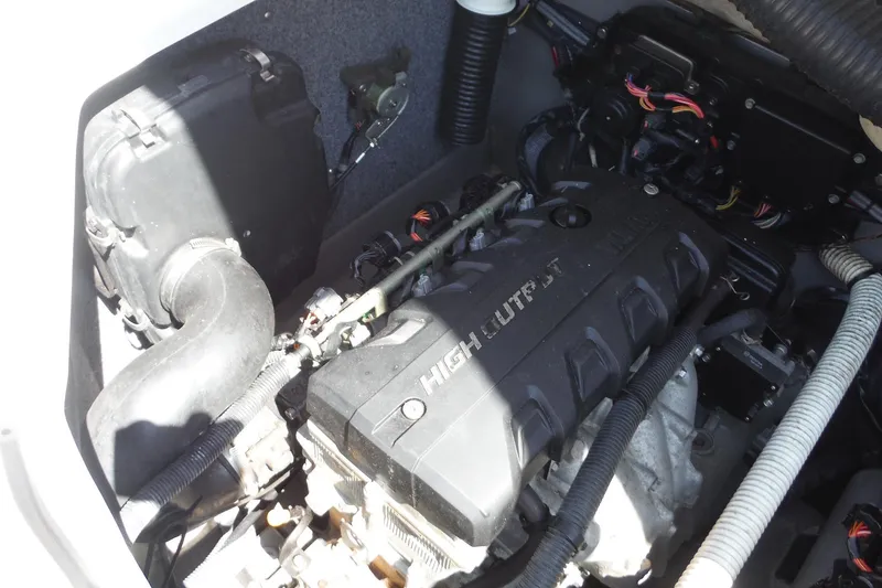 Slide: The Image of Engine compartment of a 2011 Yamaha Boats 242 Limited, featuring a high-output engine. - 23