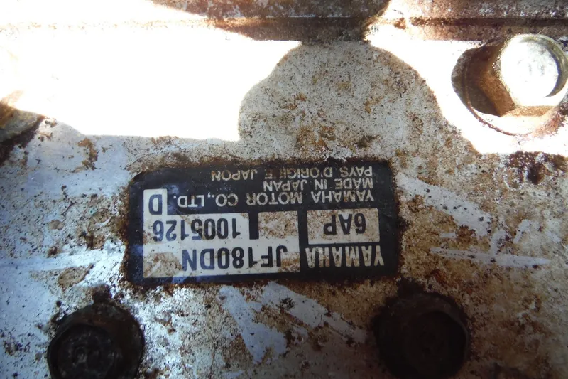 Slide: The Image of Close-up of a Yamaha motor label on a 2011 Yamaha Boats 242 Limited. - 25