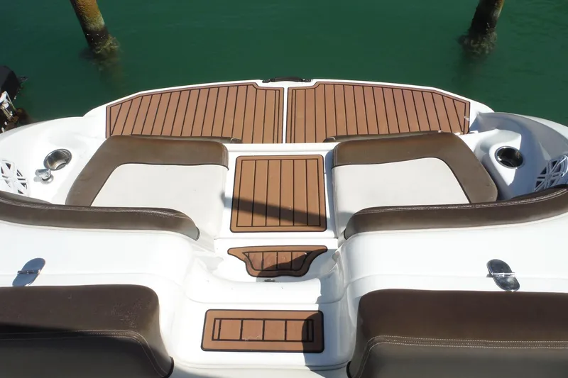 Slide: The Image of 2011 Yamaha Boats 242 Limited swim platform with brown seating and teak-style decking. - 38