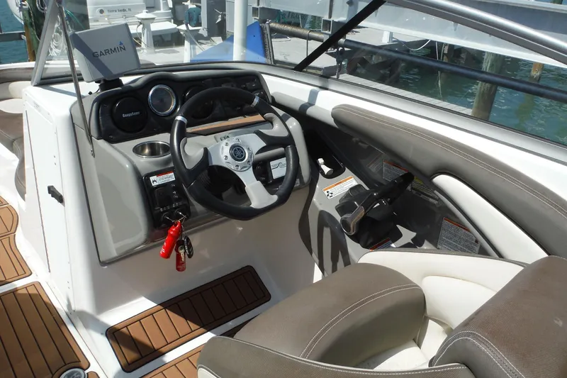 Slide: The Image of Interior view of 2011 Yamaha Boats 242 Limited cockpit with steering wheel and controls. - 4