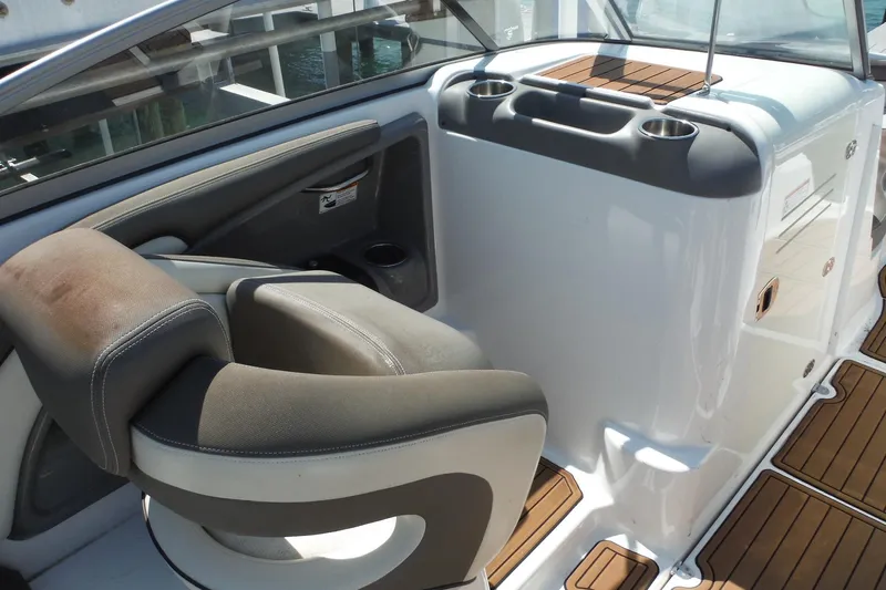 Slide: The Image of 2011 Yamaha Boats 242 Limited interior with cushioned seating and cup holders. - 5