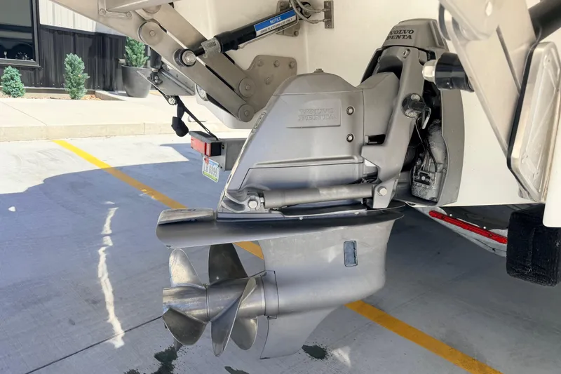 Slide: The Image of 2023 Cobalt A29 boat with Volvo Penta outdrive, parked on concrete surface. - 27