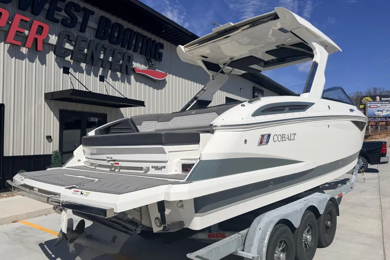 Slide: The Image of 2023 Cobalt A29 boat on trailer at dealership, sunny day. - 3