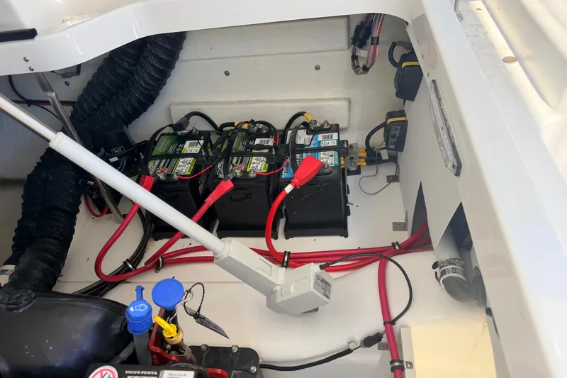 Slide: The Image of 2023 Cobalt A29 boat battery compartment with wiring and components. - 31