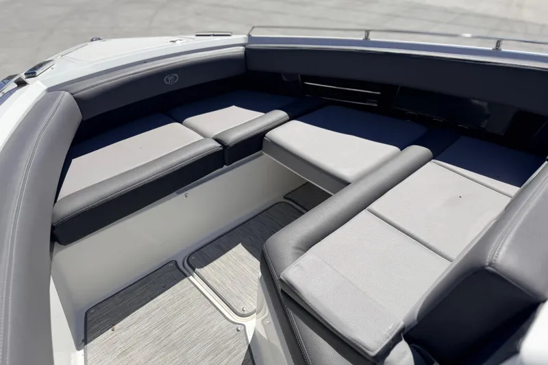 Slide: The Image of 2023 Cobalt A29 boat interior with sleek, cushioned seating in a modern design. - 13