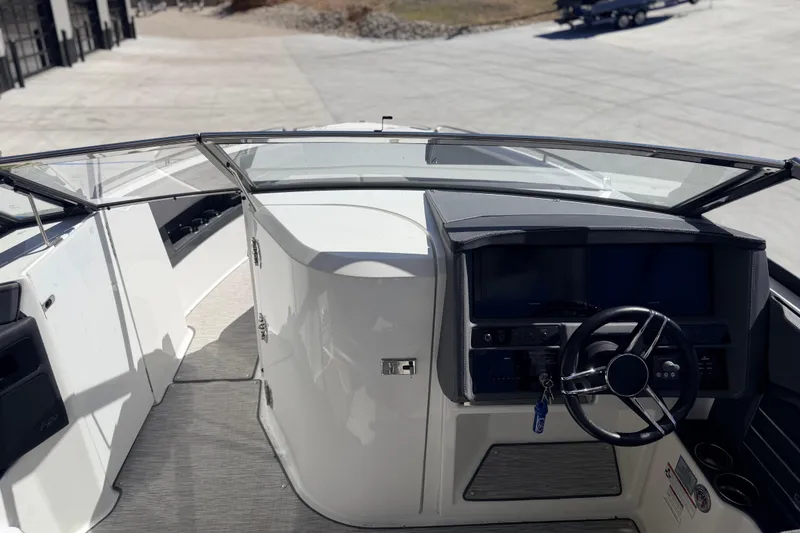 Slide: The Image of 2023 Cobalt A29 boat cockpit with modern steering and dashboard controls. - 15