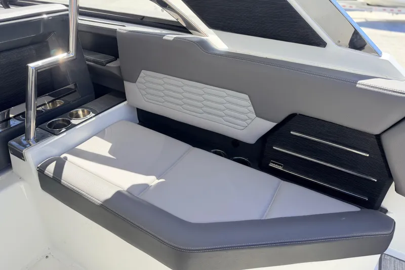 Slide: The Image of Luxurious seating area in 2023 Cobalt A29 boat with modern design and cup holders. - 16