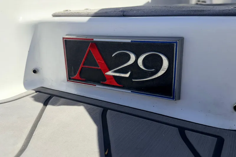Slide: The Image of 2023 Cobalt A29 boat emblem on a sleek white surface. - 25