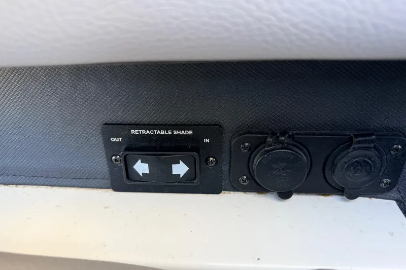 Slide: The Image of Control panel for retractable shade on 2023 Cobalt A29 boat. - 29