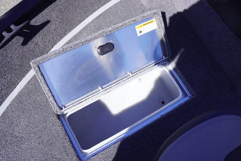 Slide: The Image of Open storage compartment on 2026 Lowe Fishing Machine 1675 WT boat deck. - 31