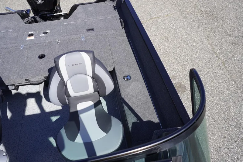 Slide: The Image of 2026 Lowe Fishing Machine 1675 WT interior with seating and deck details. - 34