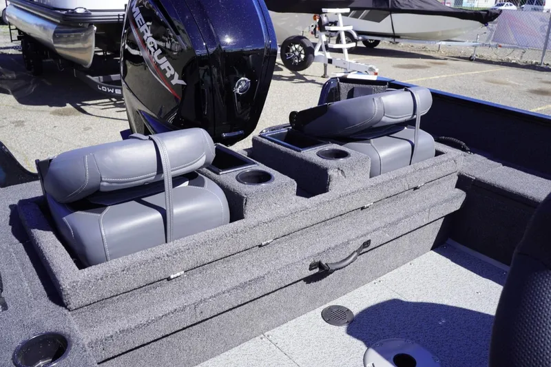 Slide: The Image of 2026 Lowe Fishing Machine 1675 WT boat interior with Mercury engine and seating. - 35