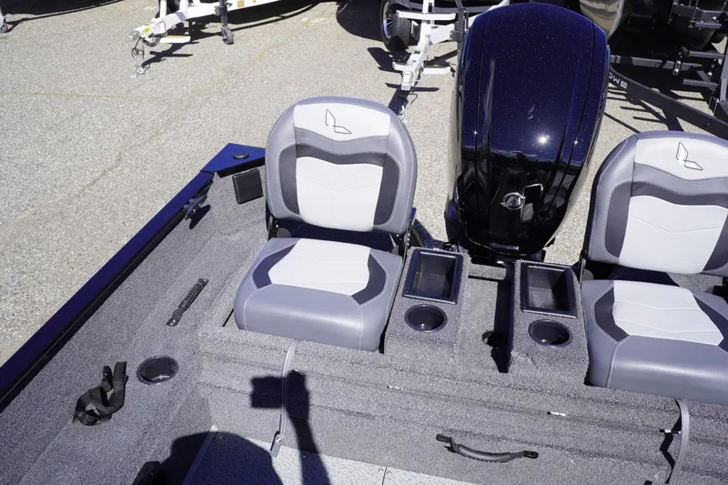 Slide: The Image of 2026 Lowe Fishing Machine 1675 WT interior with seating and motor detail. - 38