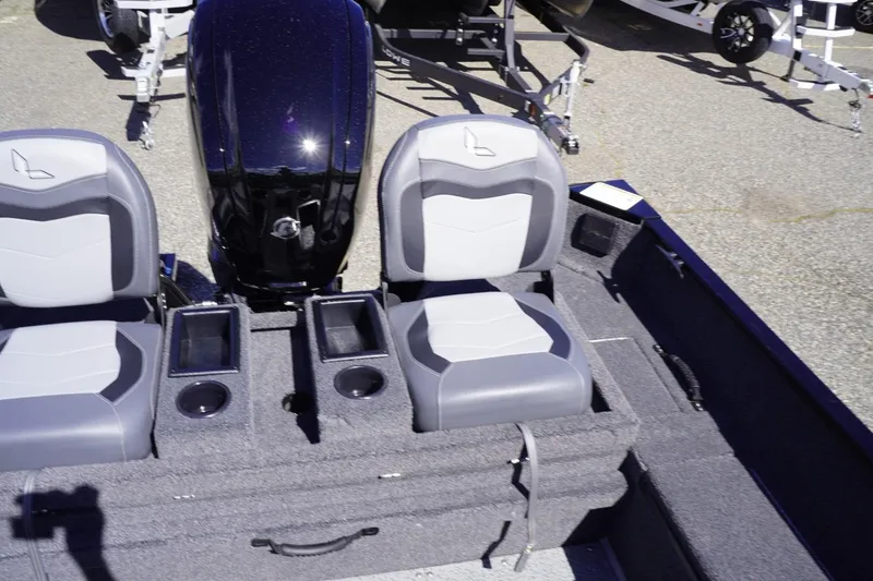 Slide: The Image of 2026 Lowe Fishing Machine 1675 WT interior with dual seats and motor. - 39