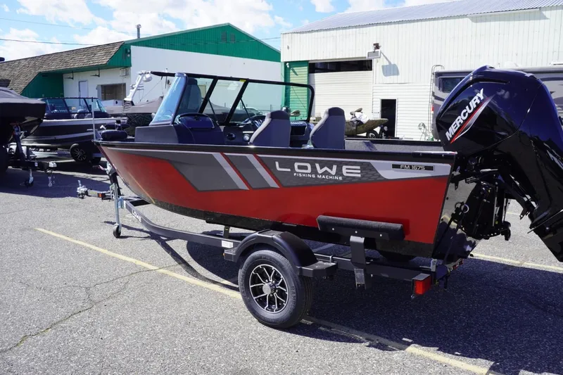 Slide: The Image of 2026 Lowe Fishing Machine 1675 WT boat on trailer, featuring a Mercury engine. - 6