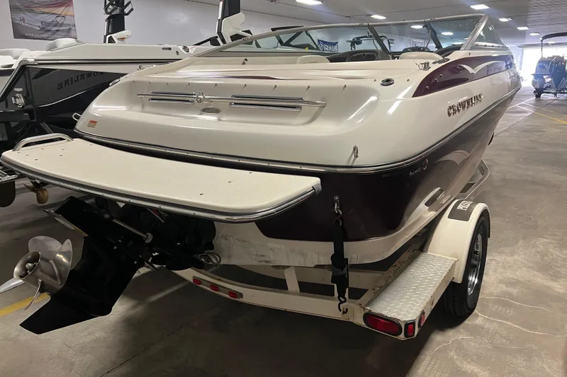 The Image of 2003 Crownline 192 BR boat on trailer in indoor storage facility. - 1