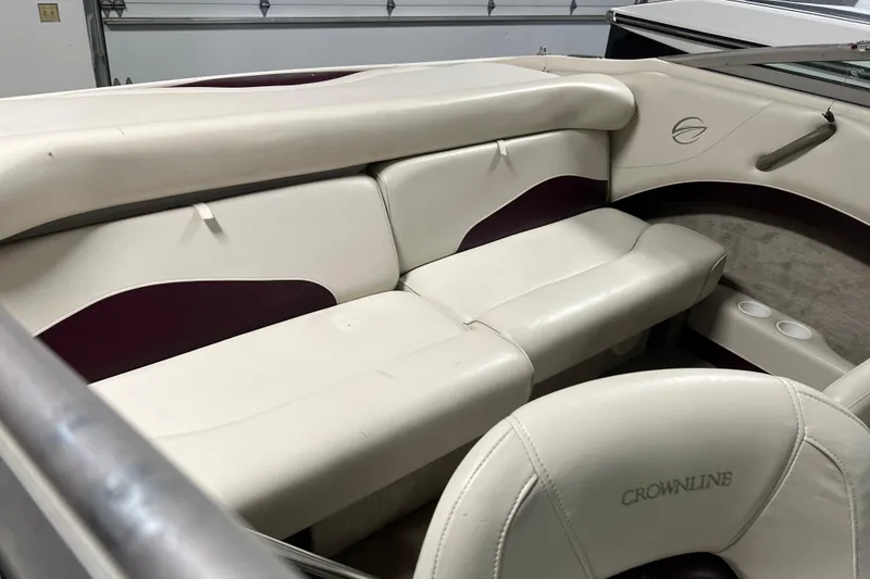 Slide: The Image of 2003 Crownline 192 BR boat interior with white and maroon seating. - 4