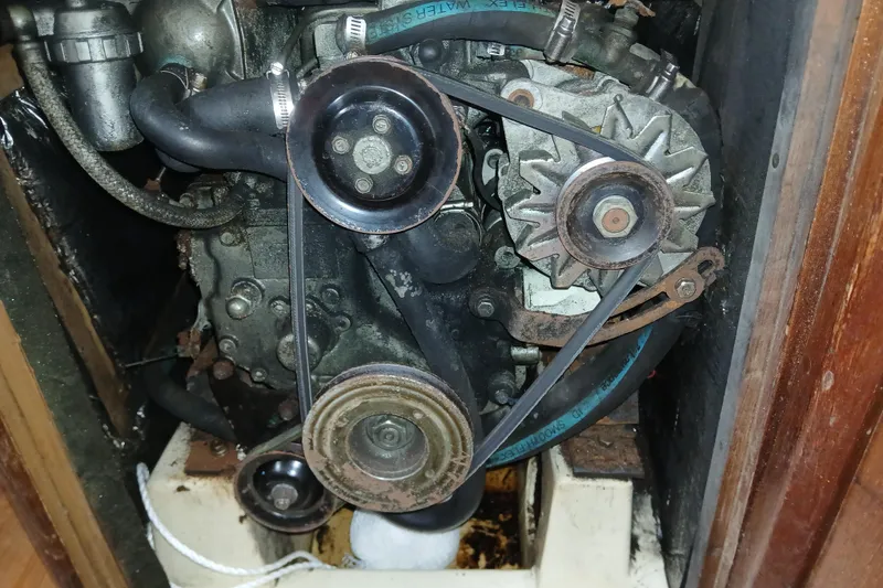 Slide: The Image of Engine compartment of a 1994 Hunter 30 sailboat, showing belts and pulleys. - 13