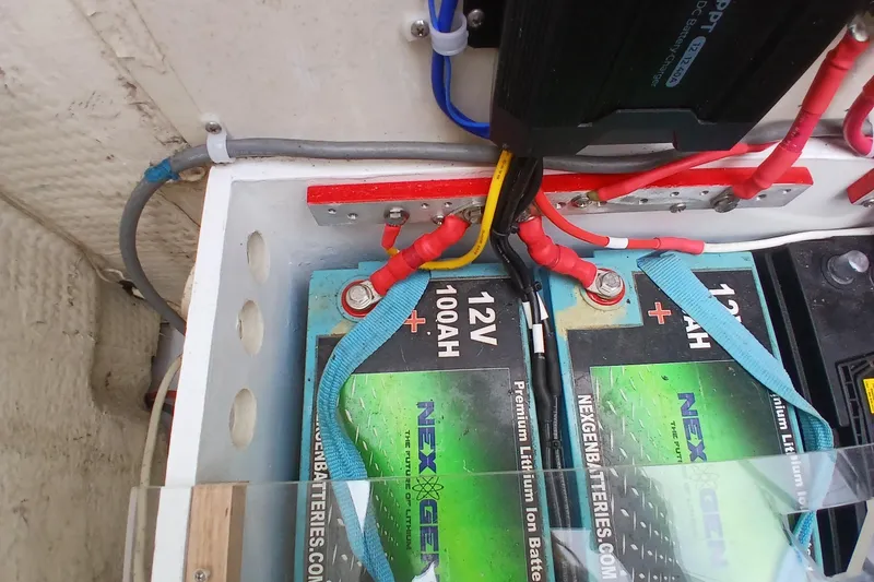 Slide: The Image of 12V lithium batteries with wiring in a 1994 Hunter 30 boat. - 21