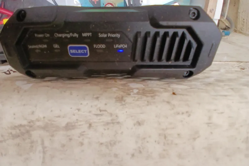 Slide: The Image of Battery charger with various settings and indicators, including LiFePO4 and MPPT, on a Hunter 30. - 22