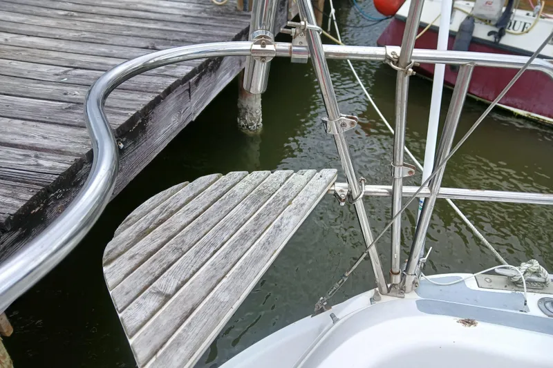 Slide: The Image of Sailboat stern with wooden step and metal railing, Hunter 30, 1994 model. - 27