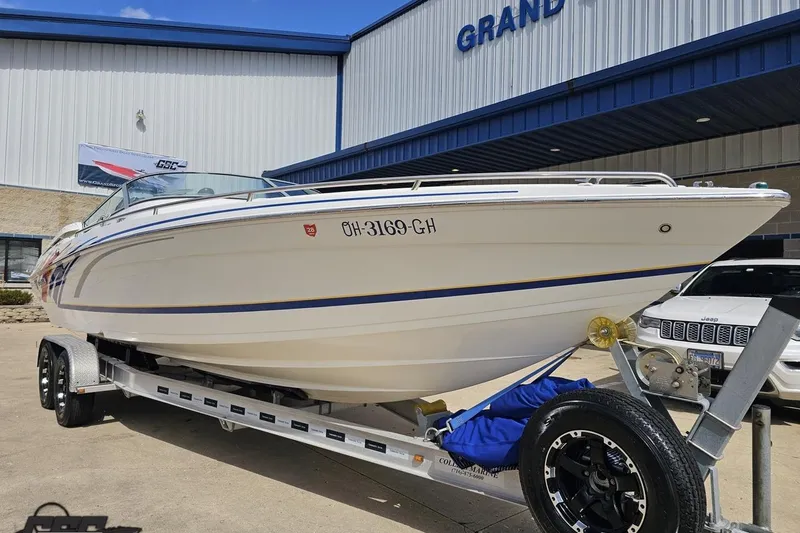 Slide: The Image of 2008 Formula 271 FASTech boat on trailer outside dealership. - 14