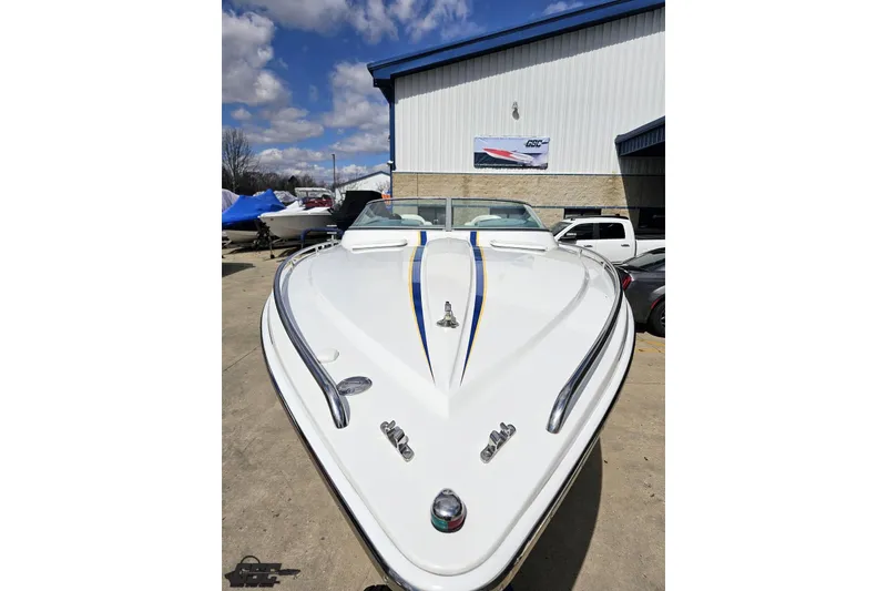 Slide: The Image of 2008 Formula 271 FASTech boat with sleek design, parked outdoors under a blue sky. - 15