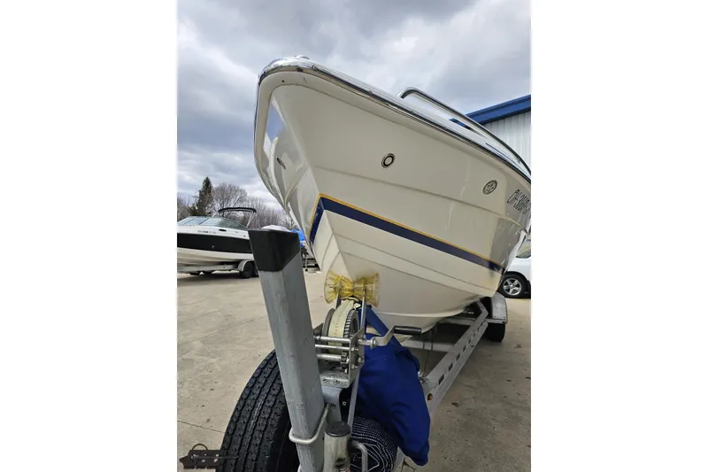 Slide: The Image of 2008 Formula 271 FASTech boat on trailer, parked outdoors under cloudy sky. - 16