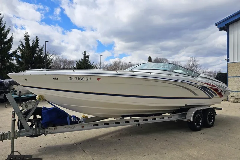 Slide: The Image of 2008 Formula 271 FASTech boat on trailer, parked outdoors under cloudy sky. - 17