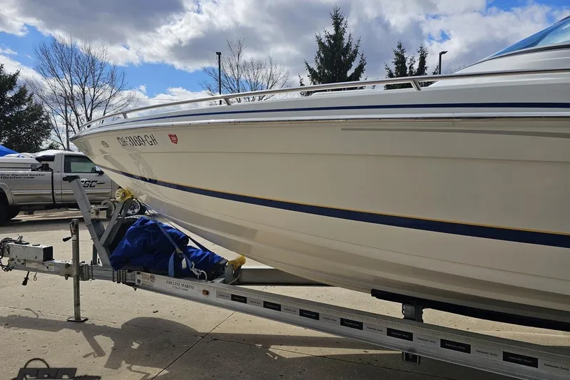 Slide: The Image of 2008 Formula 271 FASTech boat on trailer under cloudy sky. - 19