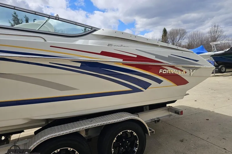 Slide: The Image of 2008 Formula 271 FASTech boat on trailer, featuring colorful graphics and sleek design. - 21
