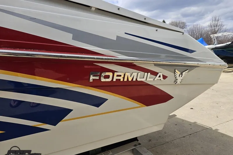 Slide: The Image of 2008 Formula 271 FASTech boat with colorful graphics and logo on the side. - 22