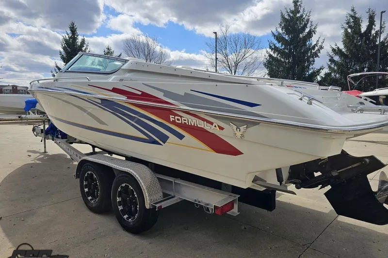 Slide: The Image of 2008 Formula 271 FASTech speedboat on trailer, featuring colorful graphics and sleek design. - 24