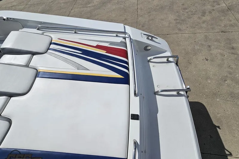 Slide: The Image of 2008 Formula 271 FASTech boat with colorful upholstery and sleek design on concrete surface. - 31