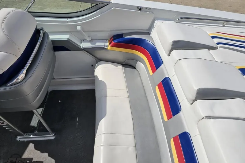 Slide: The Image of Interior of a 2008 Formula 271 FASTech boat with colorful seating and sleek design. - 39