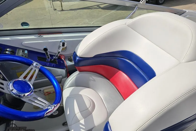 Slide: The Image of Interior of a 2008 Formula 271 FASTech boat with colorful seating and steering wheel. - 50