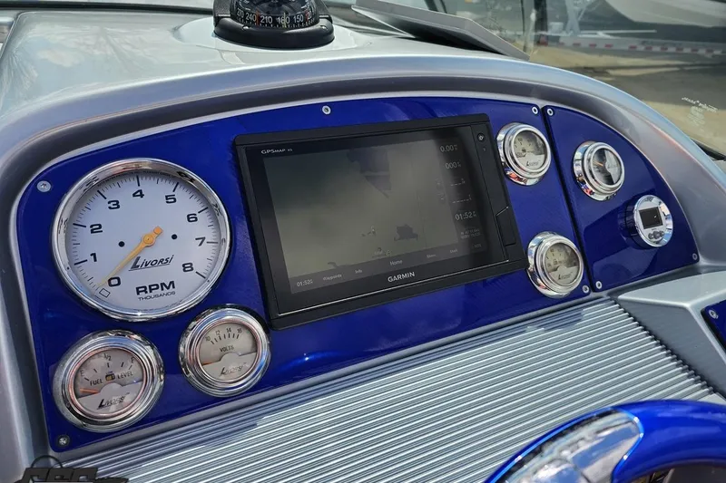Slide: The Image of Dashboard of a 2008 Formula 271 FASTech boat with gauges and Garmin GPS. - 54